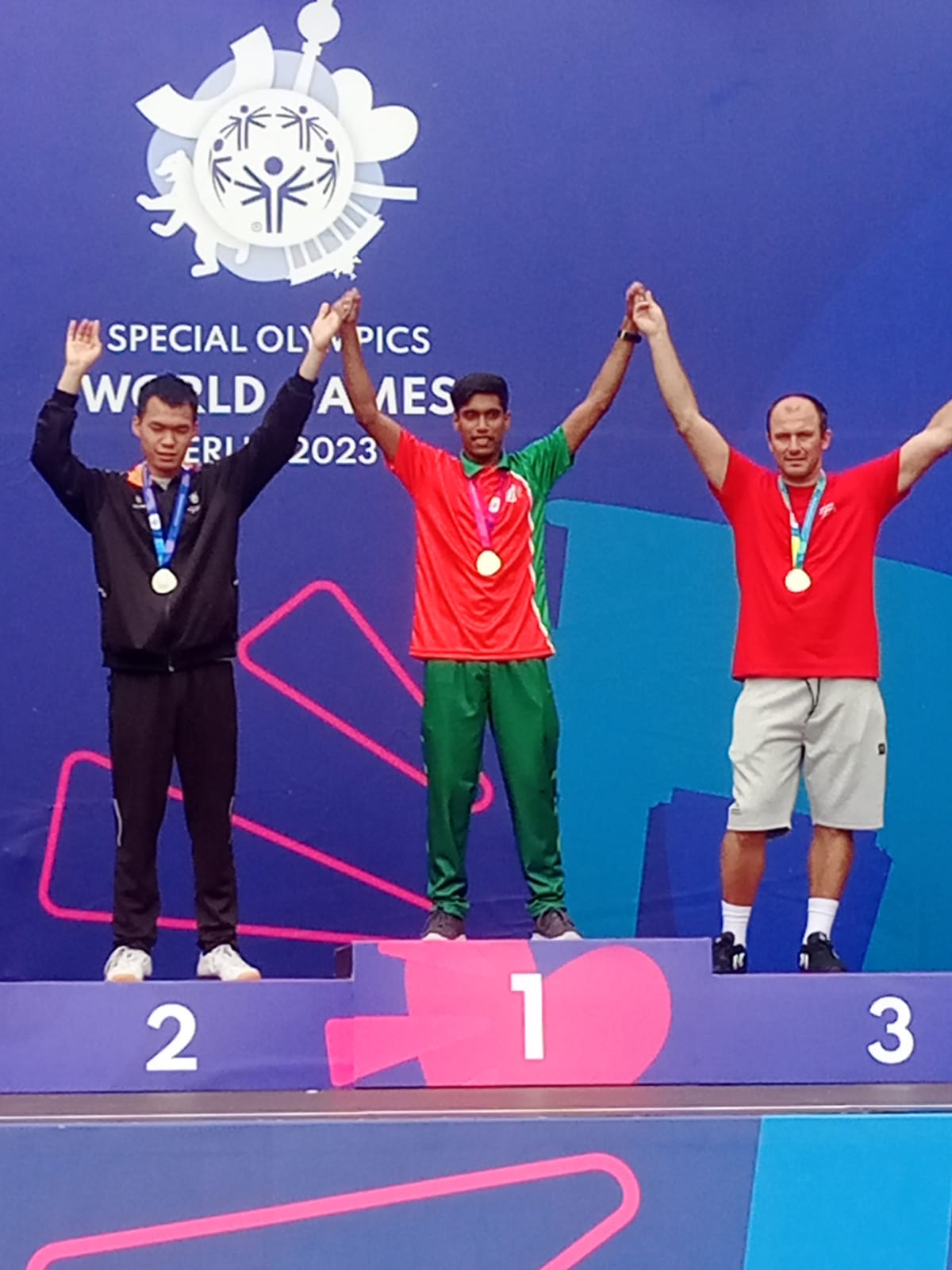 Special Olympics Bangladesh athlete sprinting during a track event.